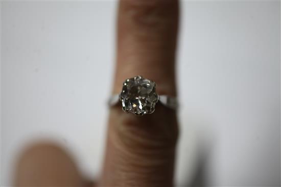 A platinum and solitaire old cushion cut diamond ring, size O.